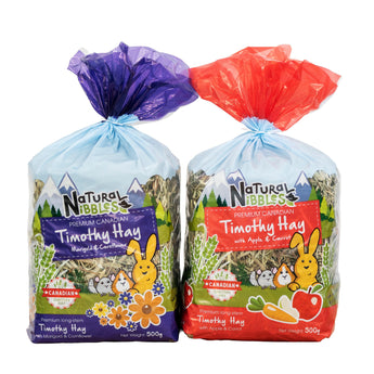 Bunny Bistro Natural Nibbles Canadian Timothy Hay Twin Pack with Marigold & Cornflower, and Apple & Carrot varieties.